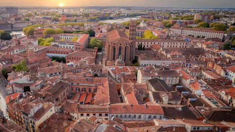 This Destination In France Is Known As The 'Pink City' — And It's Like A Mini Paris